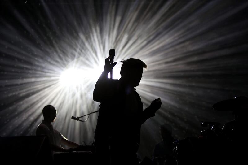 James Murphy from the American band LCD Soundsystem is silhouetted against a stage spotlight during the ‘Paredes de Coura’ music festival in Portugal. Estela Silva / EPA