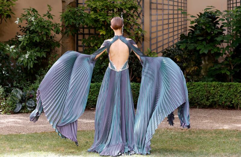 Van Herpen's outfits included an iridescent blue pleated dress reminiscent of the fins of a fish. Getty