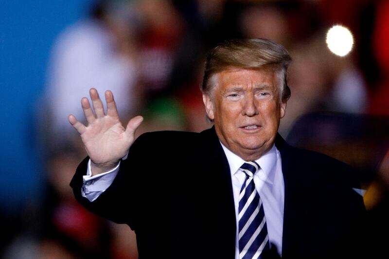 President Donald Trump waves to the crowd during a campaign rally Thursday, Nov. 1, 2018, in Columbia, Mo. (AP Photo/Charlie Riedel)
