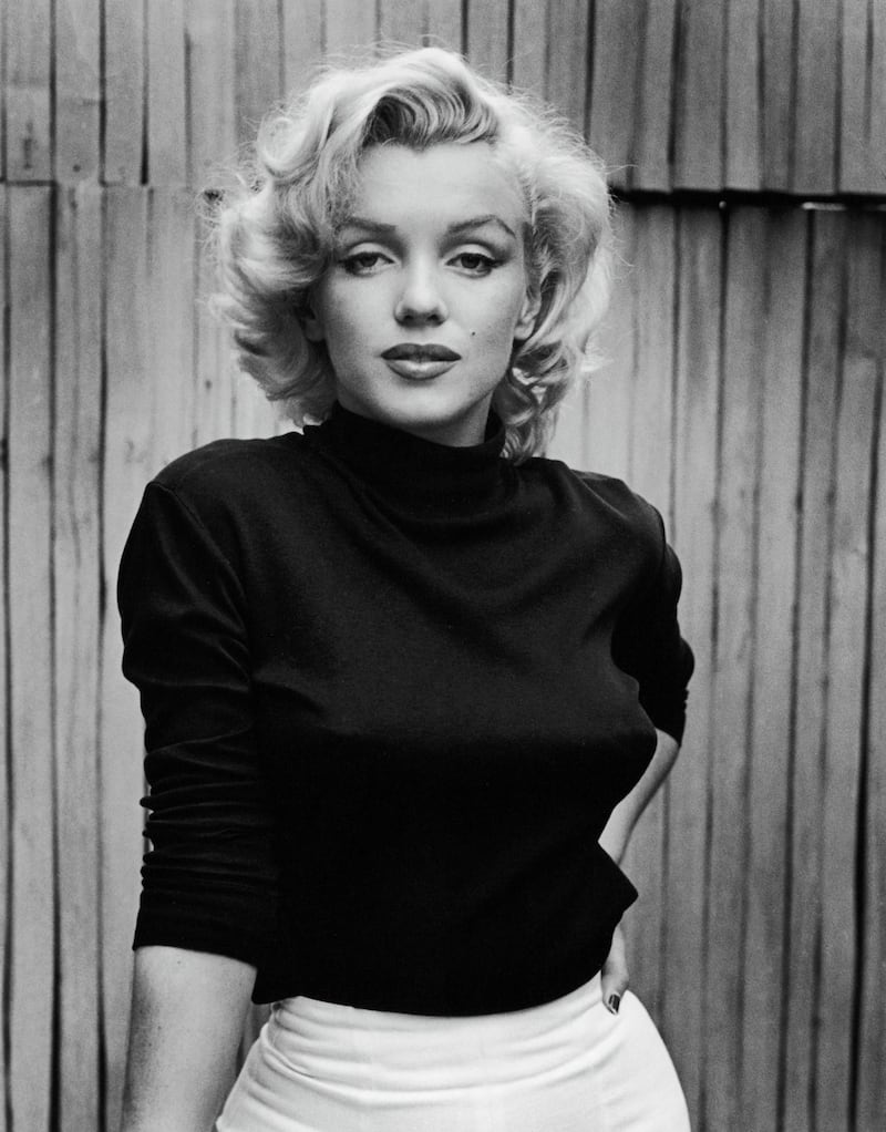 Portrait of American actress Marilyn Monroe (1926 - 1962) as she poses on the patio outside of her home, Hollywood, California, May 1953. (Photo by Alfred Eisenstaedt/The LIFE Picture Collection via Getty Images)