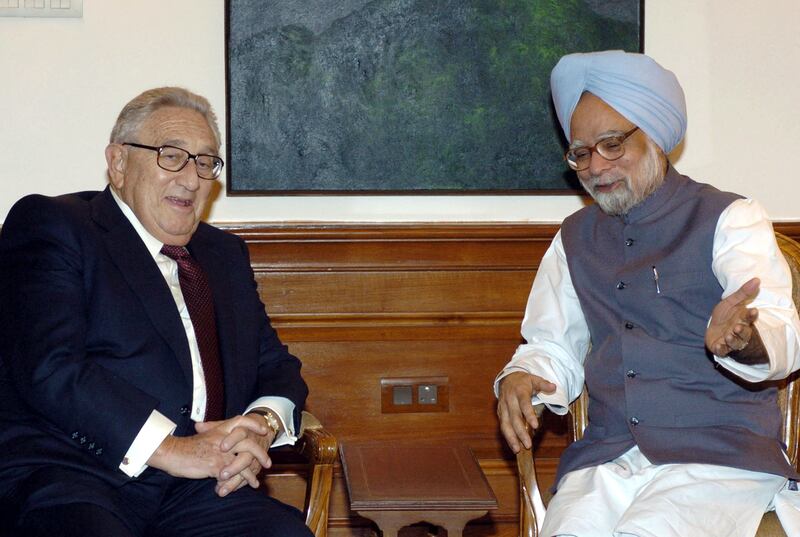 Indian prime minister Manmohan Singh with Mr Kissinger in New Delhi, in 2004. AFP