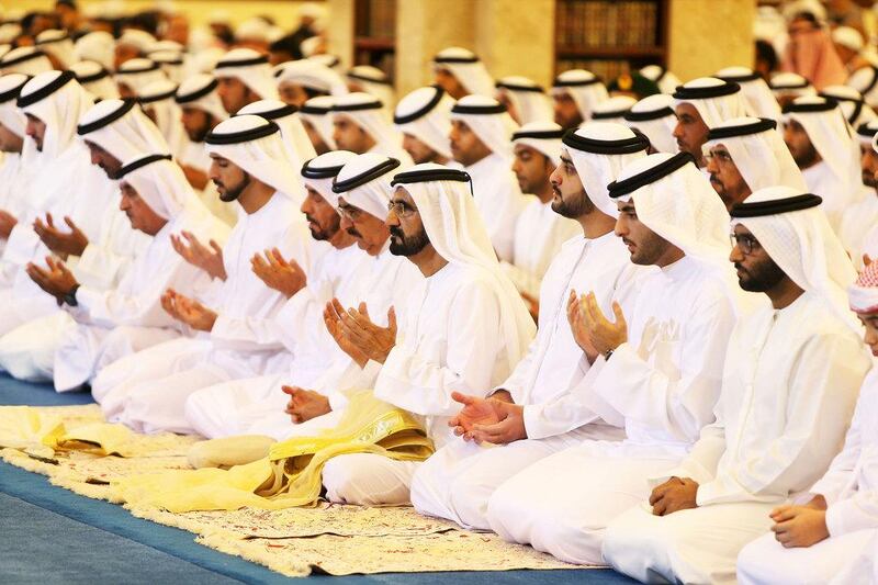 Sheikh Mohammed bin Rashid, Vice President and Prime Minister of the UAE and Ruler of Dubai, centre, leads Eid prayers ay Zabeel Mosque in Dubai. Pawan Singh / The National