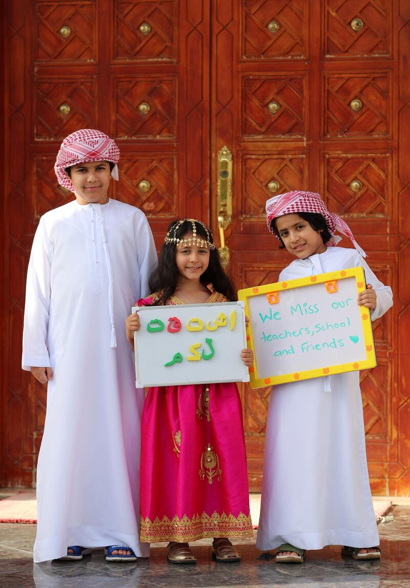Dubai, United Arab Emirates - Reporter: N/A. Photo Project. Missing our teachers. L-R Bader, Aisha and Zeyad, aged 8, 5 and 7 from the UAE and their teachers are Mr. Ben, Ms Basemah, Ms Katy, Ms Hanadi, Ms. Riz and Ms Seera at GEMS national school for boys and Gems national school for girls. "Thanks so much". Monday, June 8th, 2020. Dubai. Chris Whiteoak / The National