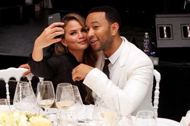 Teigen and John Legend at the White Party dinner hosted by Andrea and Veronica Bocelli for the Andrea Bocelli Foundation and Muhammad Ali Parkinson Centre, on September 5, 2014, in Forte dei Marmi, Italy. Getty Images