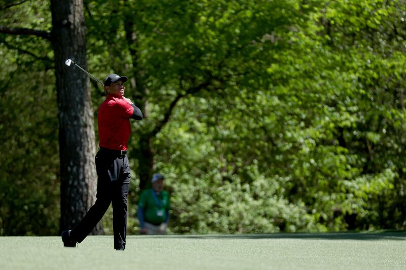 Tiger Woods hits a shot on the 11th hole during the final round of the Masters. AFP
