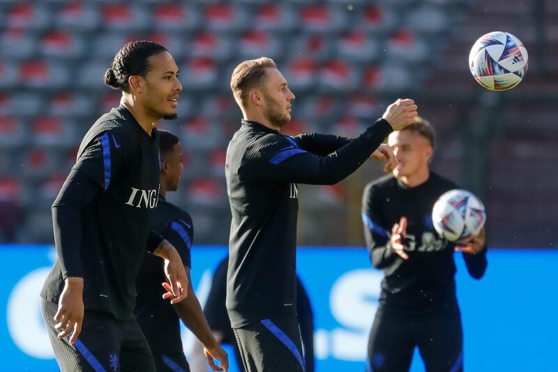 Netherlands' Vrigil van Dijk and Teun Koopmeiners attend a training session at King Baudouin Satdium in Brussels. EPA