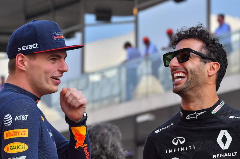 Red Bull Racing's Max Verstappen, left, and Renault's Australian driver Daniel Ricciardo chat during the drivers parade. AFP