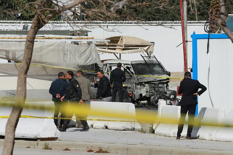 Police and forensic experts inspect the scene of an explosion near the US embassy in the Tunisian capital Tunis. AFP