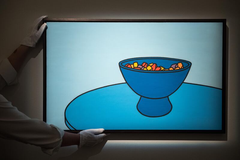LONDON, ENGLAND - OCTOBER 20:  An art handler positions Sweet Bowl by Patrick Caulfield during a press call for the India & Islamic Exhibition at Sotheby's on October 20, 2017 in London, England.  Sotheby's opens its public exhibition of Arts of the Middle East & India featuring the personal collection of the late British artist Howard Hodgkin, ahead of next week's auctions in London. The personal collection of the late British artist Howard Hodgkin on view for the first time at Sotheby's London alongside the exhibition of Arts of the Middle East and India.  (Photo by Chris J Ratcliffe/Getty Images for Sotheby's)