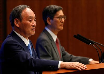 epa09279083 Japan's Prime Minister Yoshihide Suga (L) and Shigeru Omi, President of the Japan Community Health Care Organization, attend a news conference on Japan's response to the coronavirus disease (COVID-19) outbreak, at his official residence in Tokyo, Japan, 17 June 2021. The Japanese government decided to lift in nine prefectures, including Tokyo, the COVID-19 state of emergency, which is due to end on 20 June 2021. The government also decided to keep restrictions to avoid a rebound of infections before the Tokyo Olympics.  EPA/ISSEI KATO / POOL