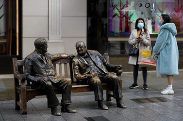 Shoppers by the 'Churchill And Roosevelt Allies Sculpture' in London, January 29, during England's third lockdown. AP