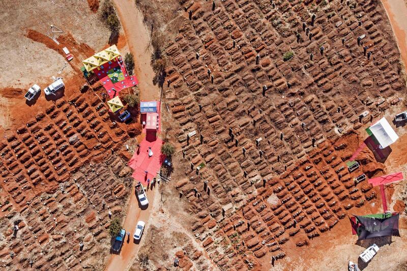 Several funerals being celebrated at the Olifantsvlei Cemetery in Soweto, South Africa.  AFP