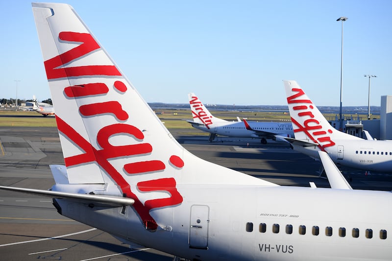 Virgin Australia aircraft sit on the tarmac at Sydney Domestic Airport in Australia. EPA