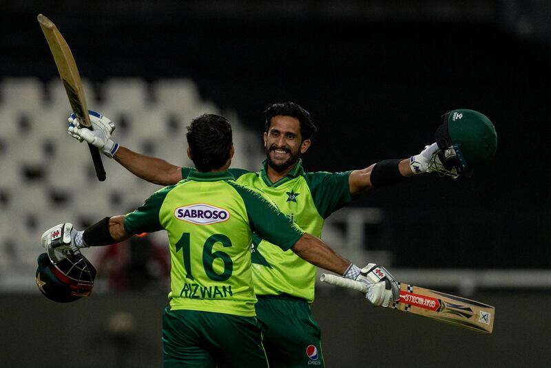 Pakistan's Hassan Ali, right, celebrates with Mohammad Rizwan after scoring winning runs. AP