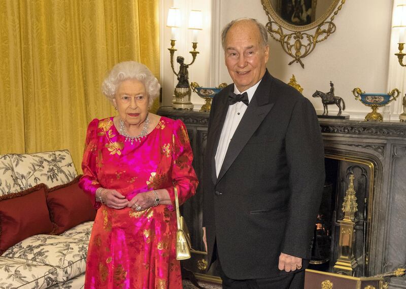 The Queen Elizabeth II and the Aga Khan in the White Drawing Room at Windsor Castle, during a reception before a private dinner to mark the diamond jubilee of the Aga Khan's leadership as Imam of the Shia Ismaili Muslim Community.
