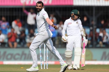India's Mohammed Shami, left, celebrates the dismissal of Bangladesh's Mushfiqur Rahim during the first day of first Test in Indore. AP