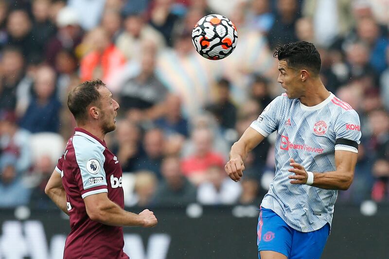 Manchester United striker Cristiano Ronaldo heads the ball under pressure from West Ham United defender Vladimir Coufal. AFP