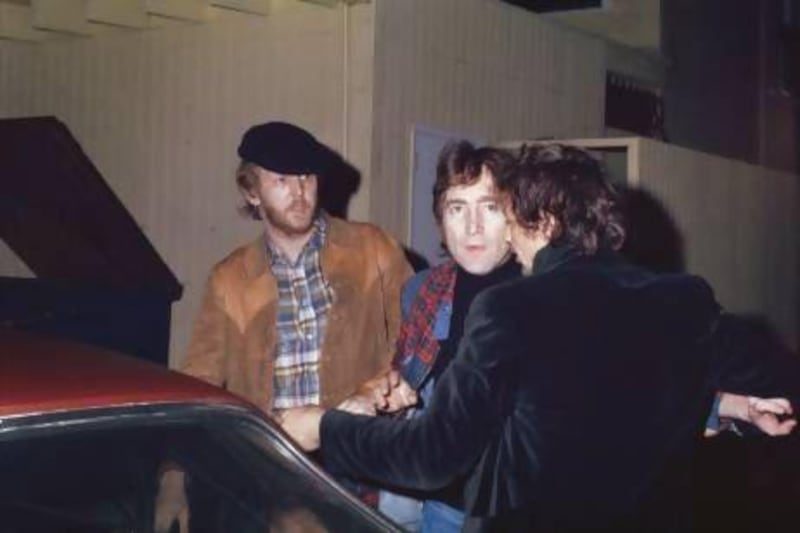 Friends Harry Nilsson, left, and John Lennon, centre, are ejected from the Troubadour nightclub in California after they heckled a performance by the Smothers Brothers in 1974. Maureen Donaldson / Getty Images