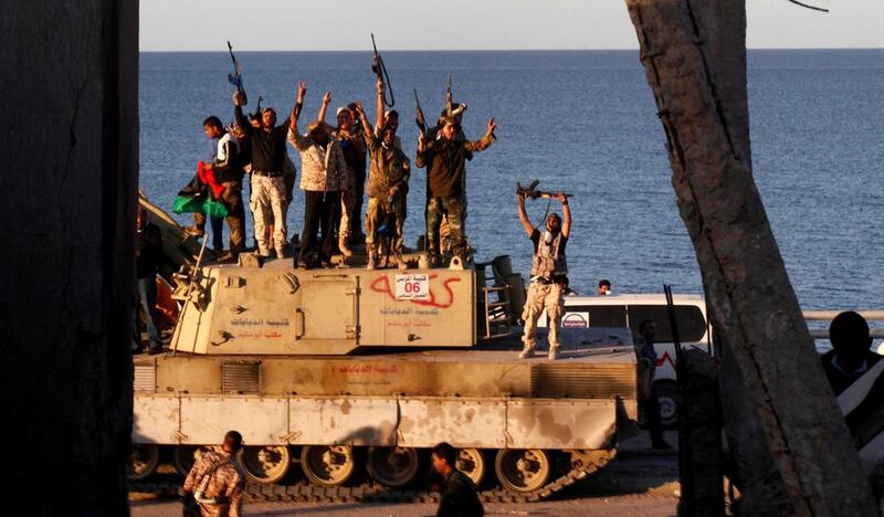 Fighters of Libyan forces allied with the UN-backed government celebrate after they finished clearing Ghiza Bahriya, the final district of the former ISIL stronghold of Sirte, Libya, December 6, 2016. Hani Amara /Reuters
