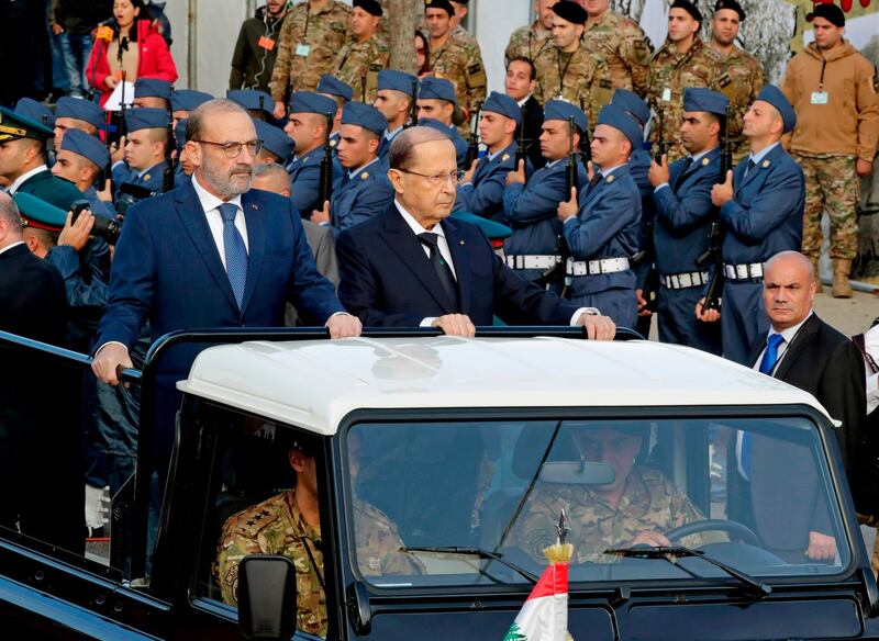 President Aoun rides on a jeep as he attends a military parade. AFP