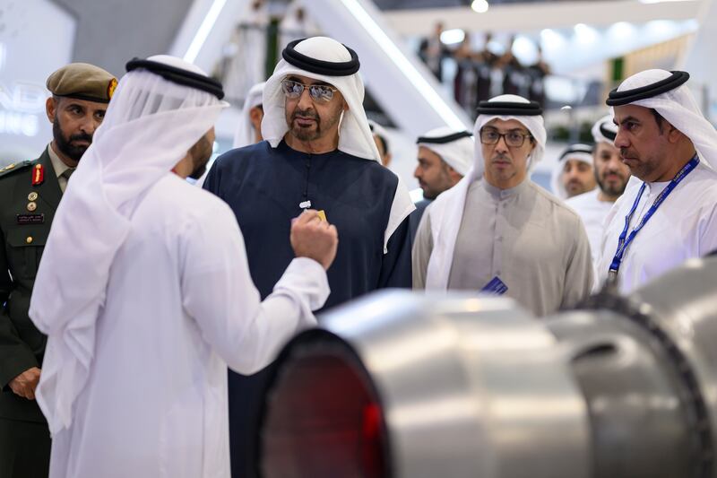President Sheikh Mohamed and Sheikh Mansour inspect an engine exhibit. Hamad Al Kaabi / UAE Presidential Court 
