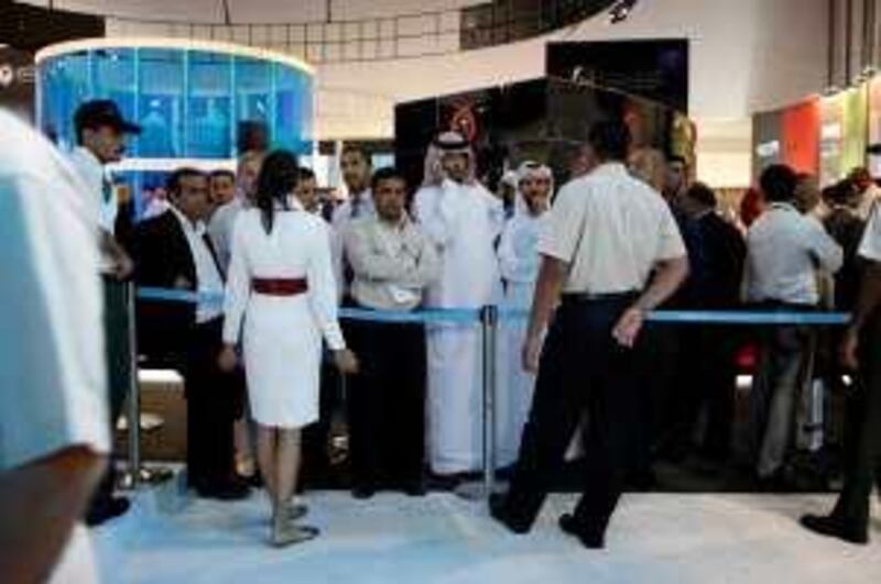 ABU DHABI, UNITED ARAB EMIRATES - May 14, 2008: People line up to inquire and buy property at the Aldar booth at the 2nd Annual Cityscape, a real estate show at the Exhibition Centre in Abu Dhabi.  ( Ryan Carter / The National ) *** Local Caption ***  RC003-Aldar.JPGRC003-Aldar.JPG