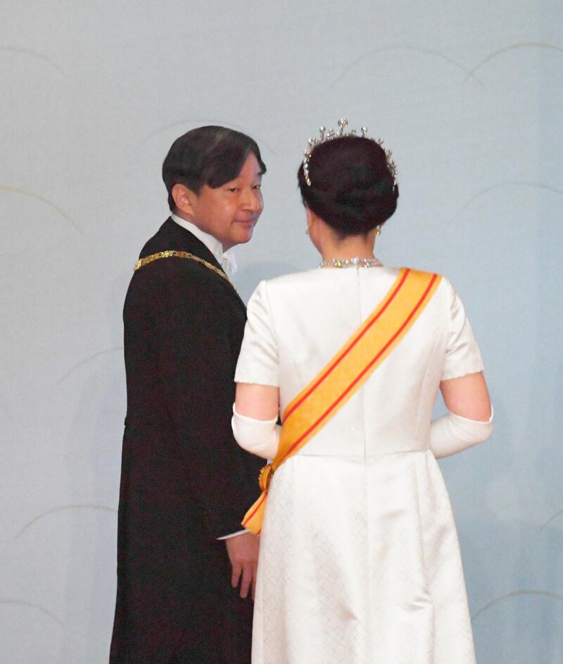 Japan's new Emperor Naruhito, accompanied by new Empress Masako, leaves after making his first address during a ritual after succeeding his father Akihito at Imperial Palace in Tokyo. AP