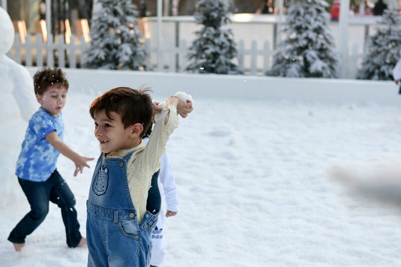 Daniel Shawky, 5, in snow at Winter Wonderland, held outside Galleria Mall, Abu Dhabi. Khushnum Bhandari / The National
