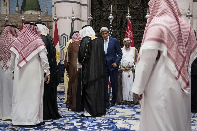 The US secretary of state John Kerry and representatives of the Gulf Cooperation Council and regional partners pose for photos at King Abdulaziz International Airport’s Royal Terminal in Jeddah, Saudi Arabia, where they met on September 11, 2014, to discuss a united front against the ISIL extremist group. Brendan Smialowski / AFP