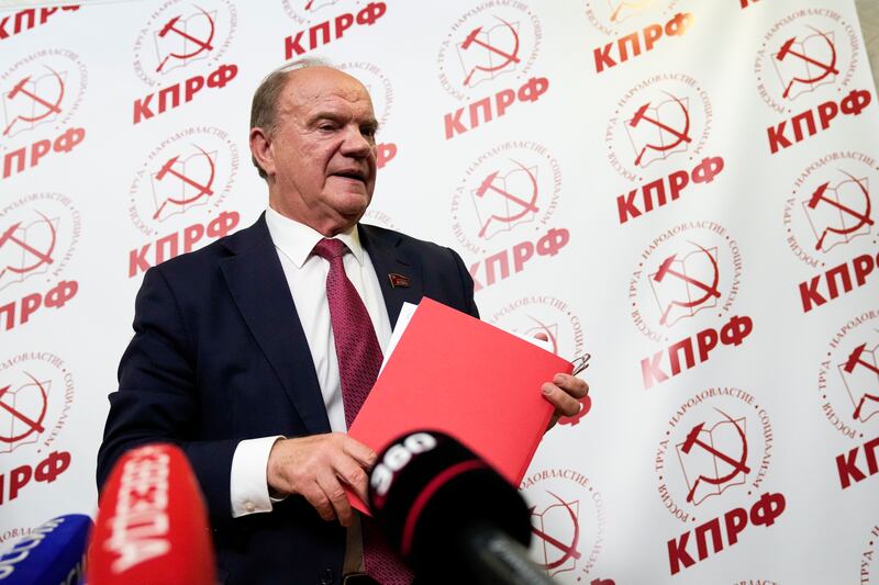 Russian Communist Party leader Gennady Zyuganov leaves a news conference.  AP