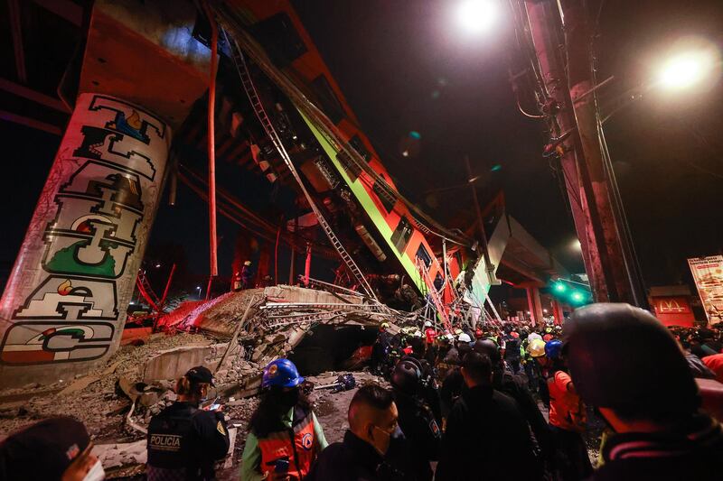 Emergency personnel search for survivors after a raised subway track collapsed in Mexico City. Getty