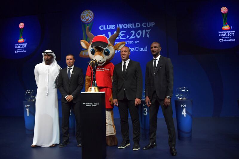 From left to right, Abdulrahim Jumaa, Ivan Cordoba, Mikael Silvestre and Eric Abidal pose for a photo with Dhabi the tournament mascot.
