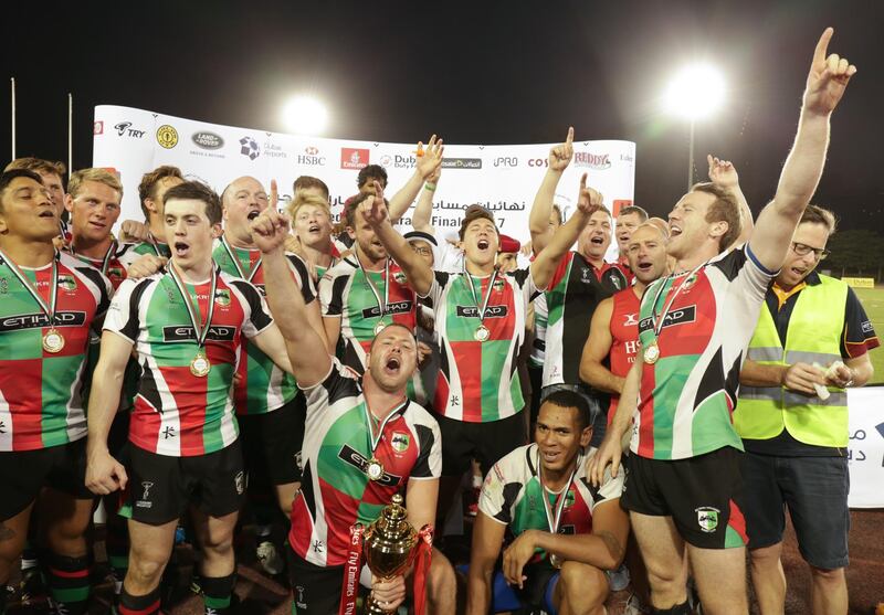 Dubai,UAE, April 7, 2017,  Abu Dhabi Harlequins (red and green) VS. Jebel Ali Dragons (Blue) Premiership final.  The Harlequins win the Ptemiership trophy.
Victor Besa for The National
ID: 38294
Reporter:  Paul Radley
Sports *** Local Caption ***  VB_040717_sp-rugby-26.jpg