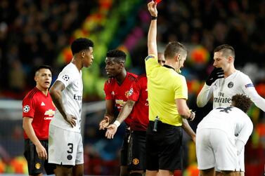 Paul Pogba, centre, was sent off for Manchester United against Paris Saint-Germain to sum up a miserable night for Ole Gunnar Solskjaer's men. AP