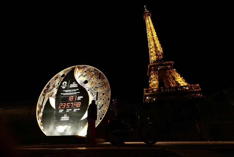 The Paris 2024 Olympics countdown clock stands near the Eiffel Tower. Reuters