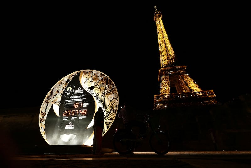 The Paris 2024 Olympics countdown clock stands near the Eiffel Tower. Reuters