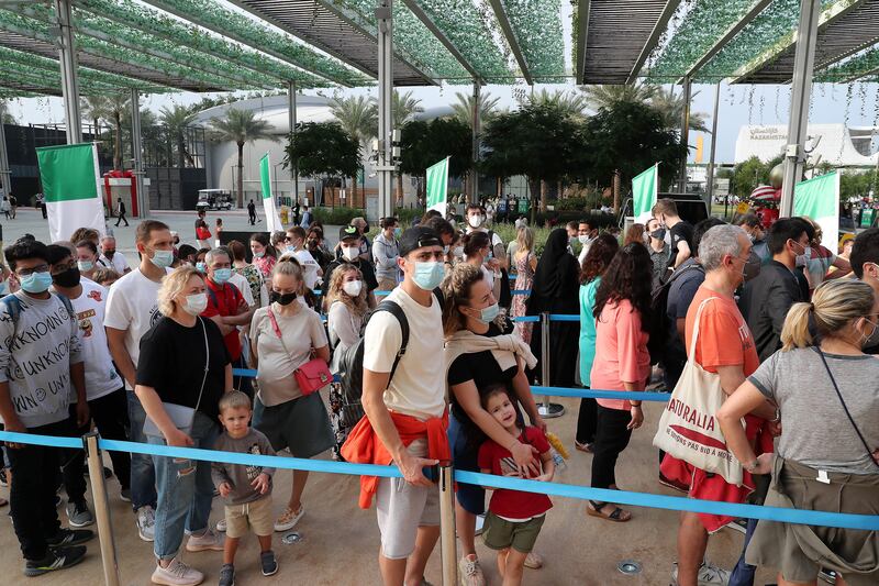 Visitors outside the Italy pavilion, which was also closed for some time so rain damage could be repaired.