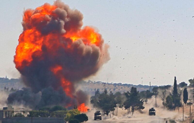 A fireball erupts from the site of an explosion reportedly targeting a joint Turkis-Russian patrol on the strategic M4 highway, near the Syrian town of Ariha in the rebel-held northwestern Idlib province, on July 14, 2020. / AFP / Mohammed AL-RIFAI

