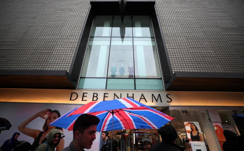 FILE PHOTO: Shoppers walk past Debenhams on Oxford Street in central London, Britain, April 2, 2018. REUTERS/Hannah McKay/File Photo