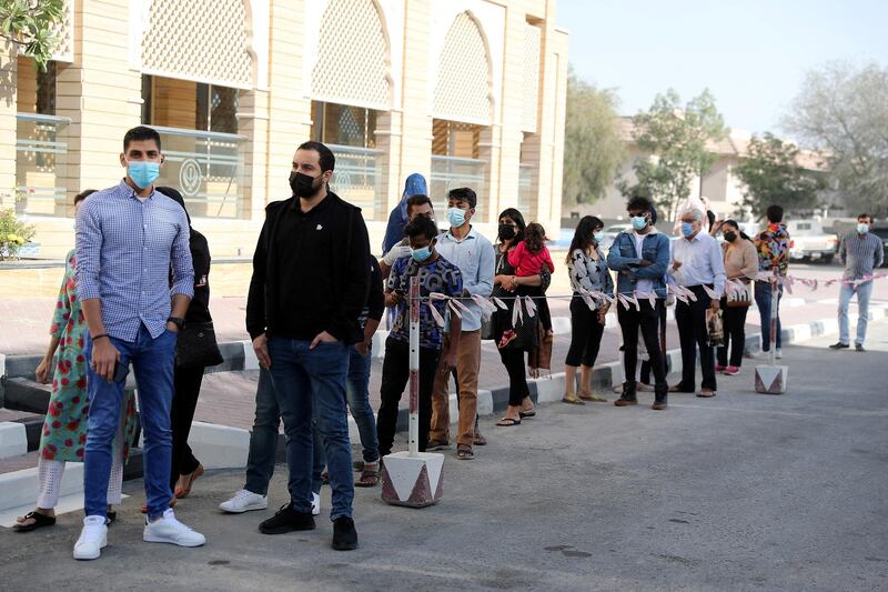 DUBAI, UNITED ARAB EMIRATES , Feb 6 – PEOPLE STADING IN A QUEUE TO GET THE FIRST DOSE OF SINOPHARM VACCINATION DRIVE AT THE GURU NANAK DARBAR GURUDWARA IN DUBAI. Guru Nanak Darbar Gurudwara has partnered with Tamouh Health Care LLC, to provide on-site Sinopharm Vaccination for all residents of the UAE free of charge on 6th, 7th & 8th February 2021. (Pawan Singh / The National) For News/Online