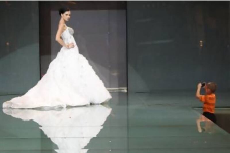 Most weddings feature a stage on which the bride sits. Big-budget affairs may also include a catwalk for her to show off her dress. Randi Sokoloff / The National