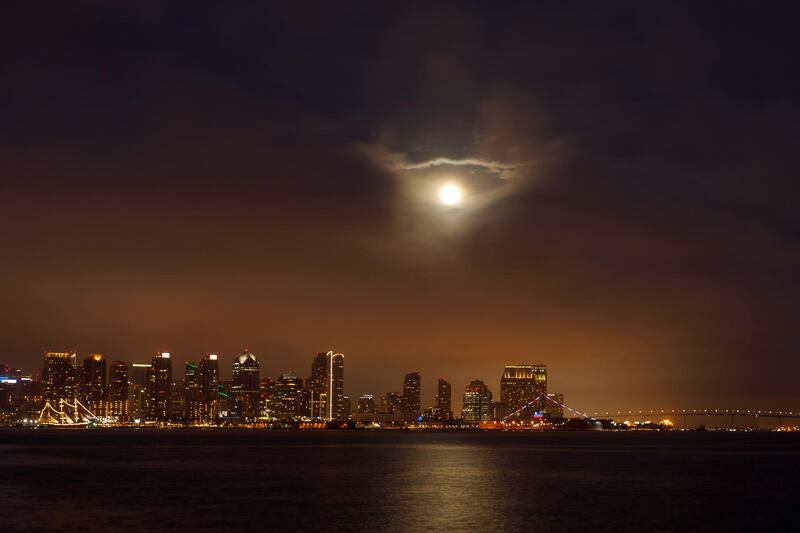 The Super Flower Blood Moon was visible through low clouds above San Diego, California. Reuters