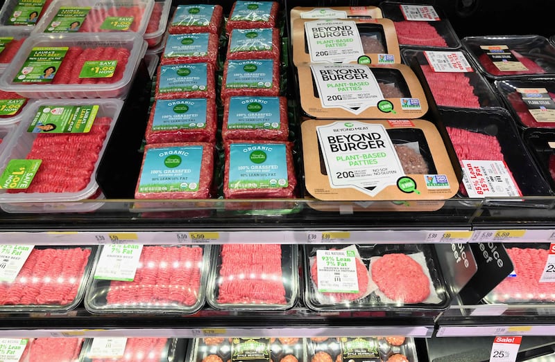 Beyond Meat's products made from plant-based substitutes for meat displayed alongside ground beef for sale at a US supermarket. ADM is the latest alternative meat competitor planning to enter the US market. AFP