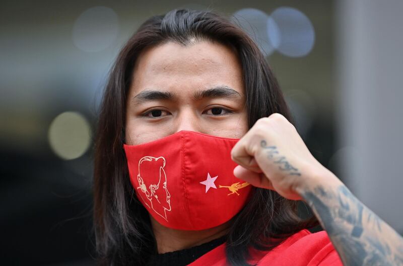 A Myanmar protester shouts slogans during a demonstration condemning the military coup in Myanmar, near the military office of the Myanmar embassy in Seoul.  AFP