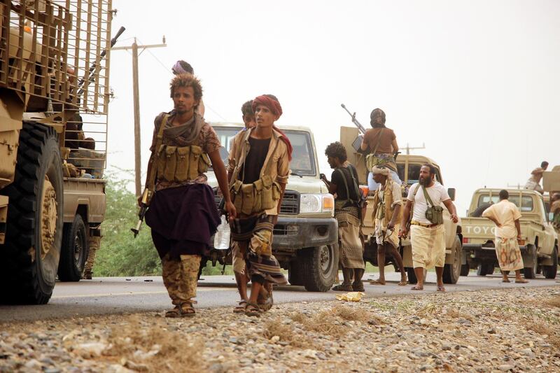 epa06810474 A column of Yemeni government forces and vehicles move closer to the western port city of Hodeidah, Yemen, 15 June 2018. According to reports, Yemen's government forces, supported by the Saudi-led coalition continued advancing towards the Red Sea's Houthi rebel bastion and seaport of Hodeidah city, bombing Houthi positions, in an attempt to gain control of the city, which is the main entry for food into the Arab country.  EPA/NAJEEB ALMAHBOOBI