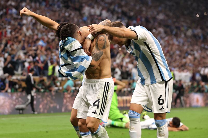 Argentina's Leandro Paredes celebrates scoring the winning penalty against France. Getty