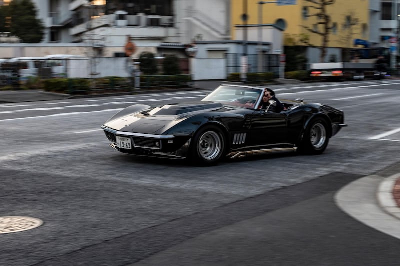Real estate and construction business owner Atsushi Hasegawa driving a 1969 Chevrolet Corvette. AFP