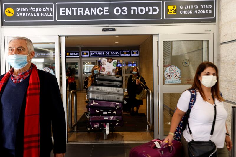 Travellers exit Israel's Ben Gurion International Airport in July 2021. Reuters