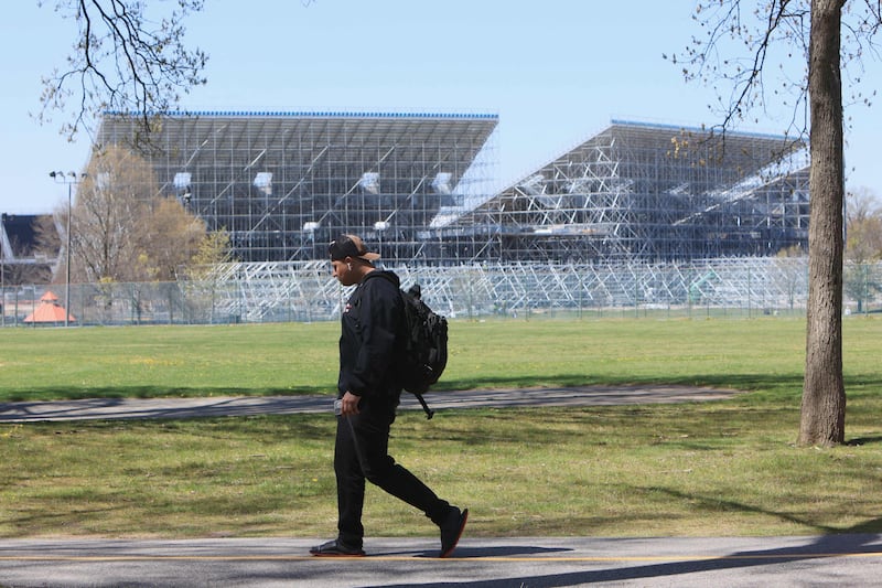 A pedestrians walks past the Nassau County International Cricket Stadium at Eisenhower Park in East Meadow, New York. AFP