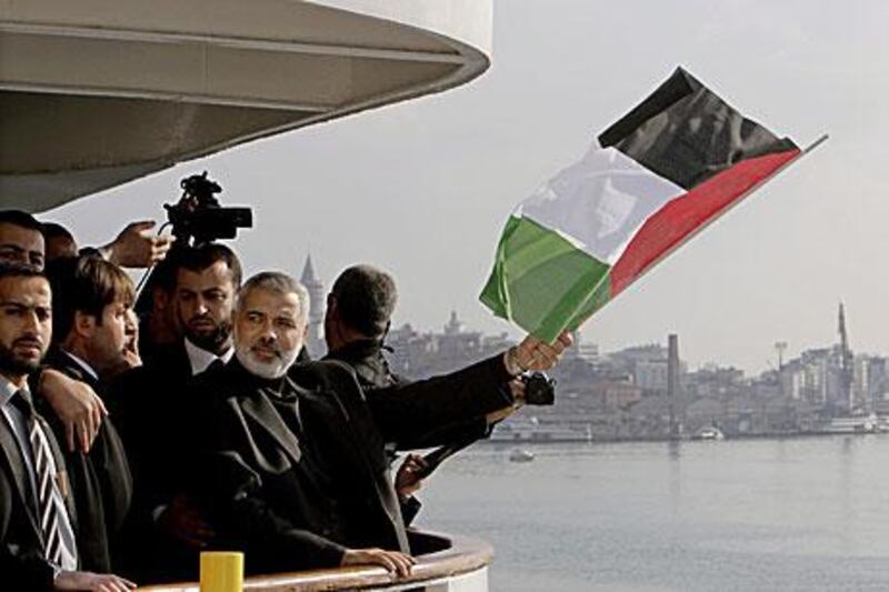 The Hamas leader Ismail Haniyeh flies the Palestinian flag aboard the Mavi Marmara during his visit in Istanbul yesterday.